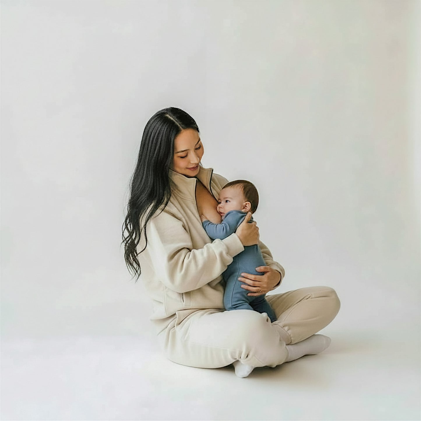 woman wearing milkmates beige nursing sweater and sweatpants set - nursing baby