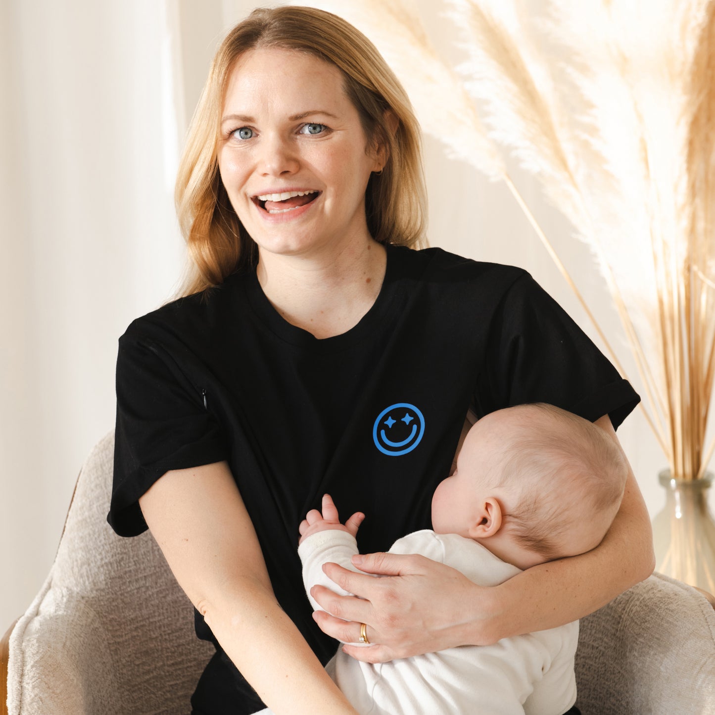 Mom breastfeeding a baby wearing milkmates nursing shirt in my mom era blue