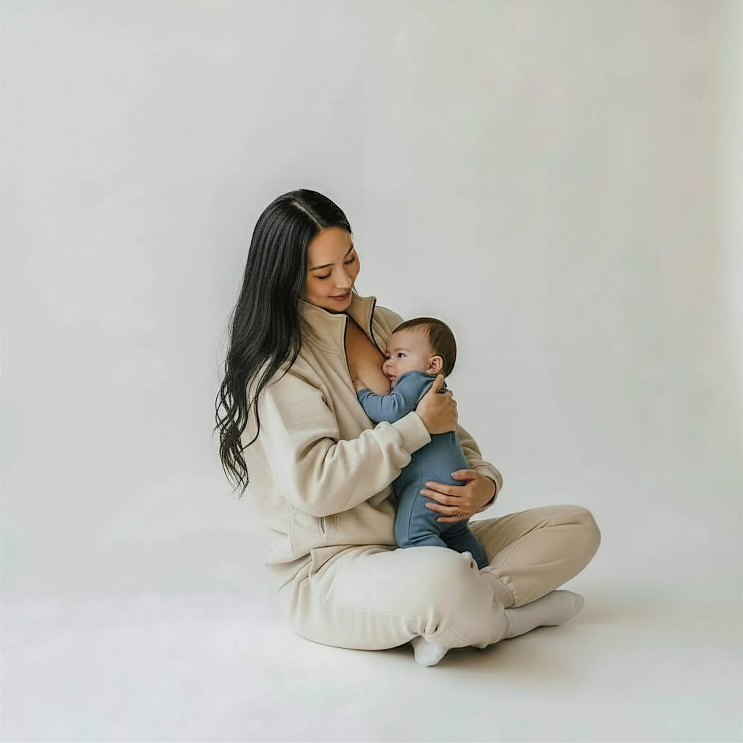 woman wearing beige milkmates nursing sweater and sweatpants set - with baby nursing