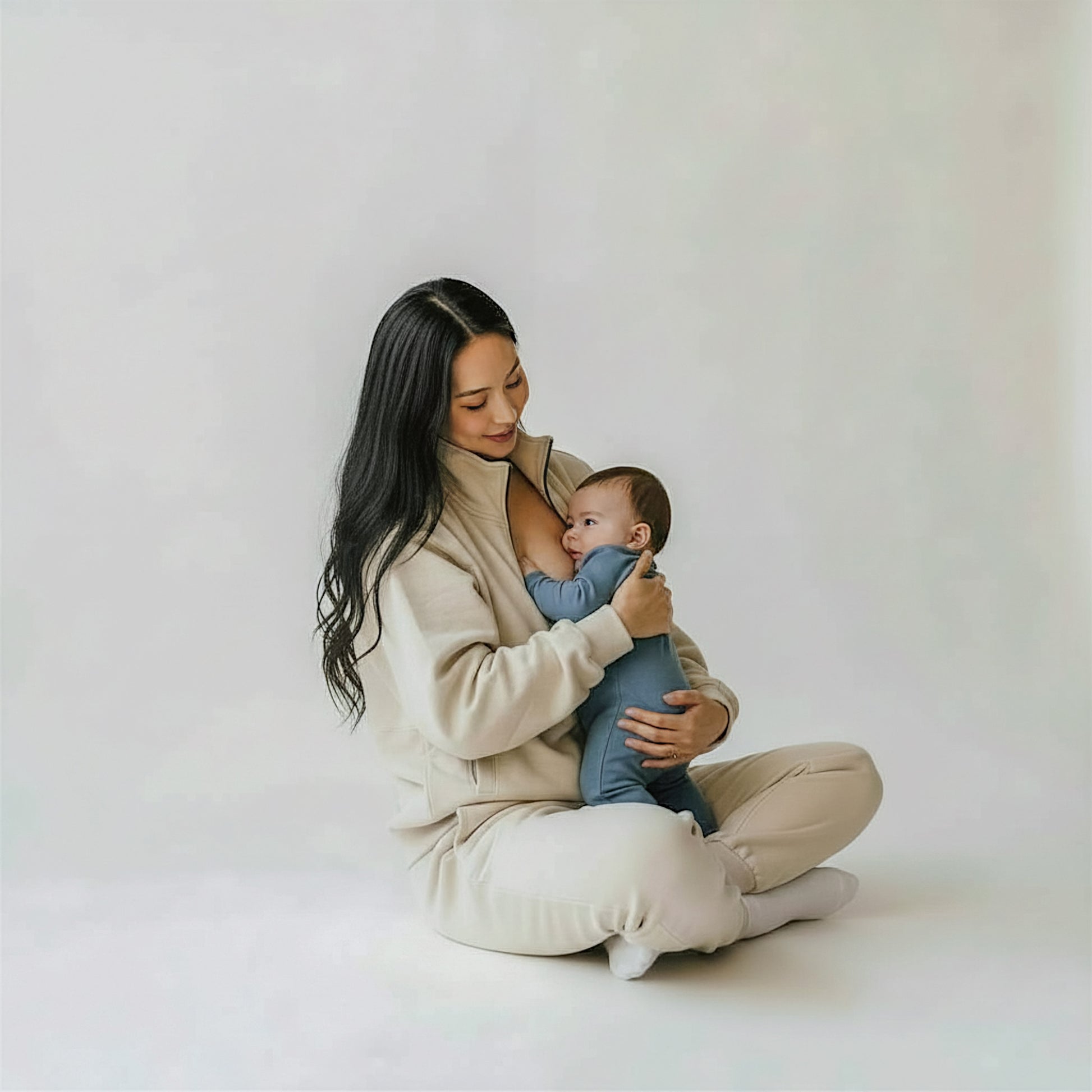 woman wearing beige milkmates nursing sweater and sweatpants set - with baby nursing