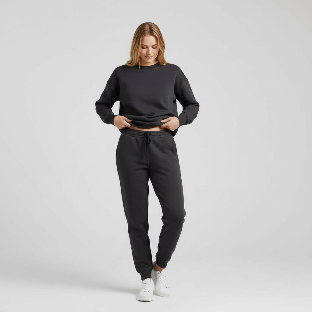 Woman wearing milkmates nursing sweater and sweatpants set - tucking in