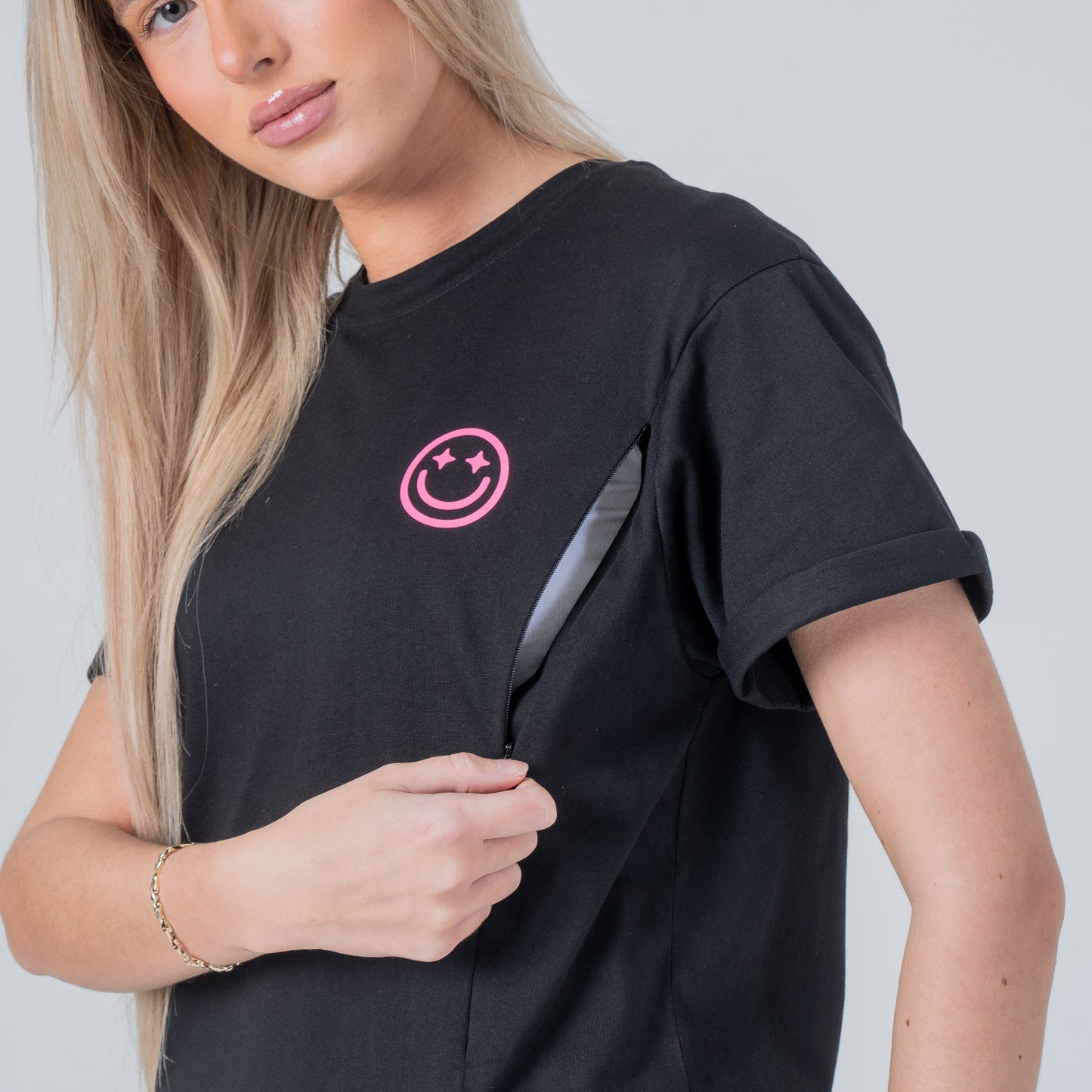 woman wearing milkmates black nursing tee side view zipper open
