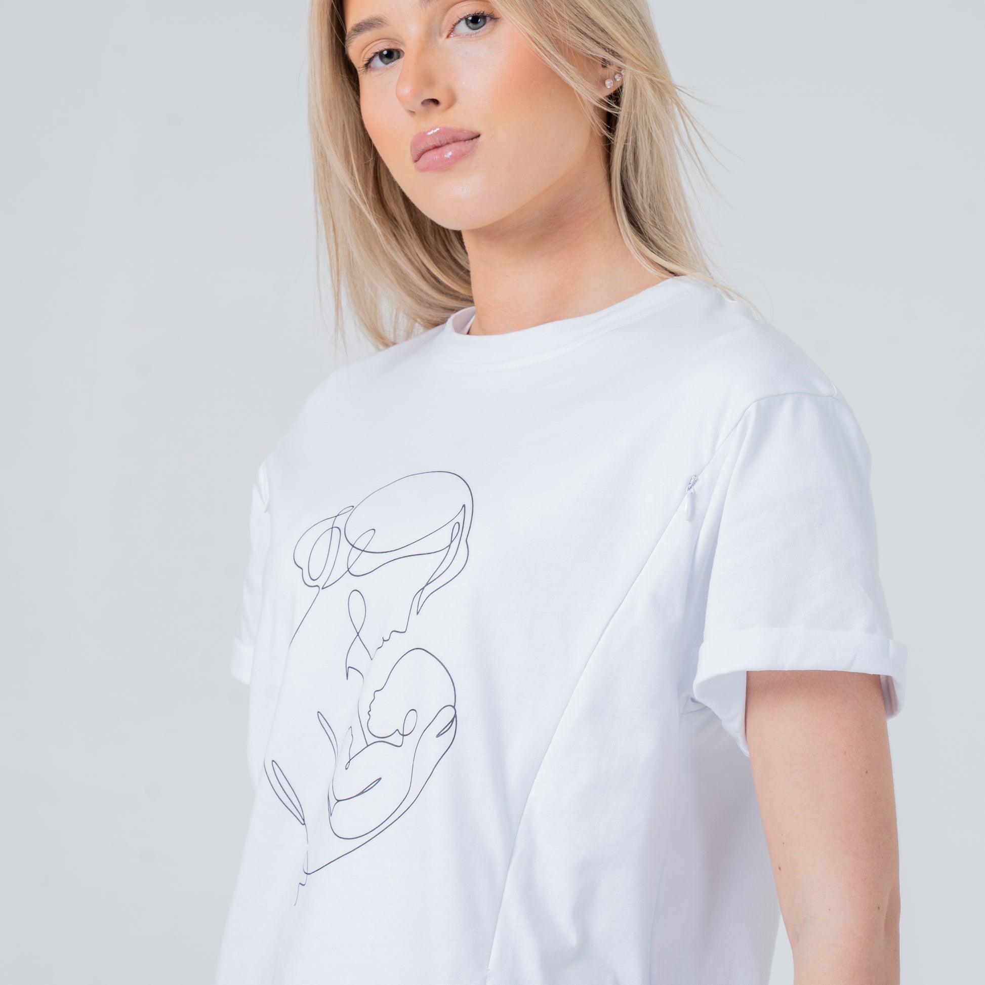 woman wearing milkmates motherhood white line art nursing tee side