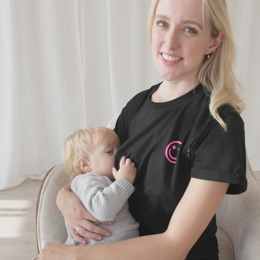 mother breastfeeding baby wearing milkmates mom era nursing t-shirt